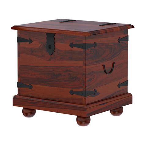 Both the coffee table and two end tables open from the top to provide a spot for your blankets, games, and remotes. Kokanee Solid Wood Storage Trunk Coffee Table 3 Piece Set