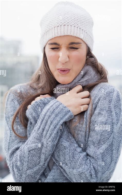 Shivering Cute Woman With Winter Clothes On Posing Stock Photo Alamy