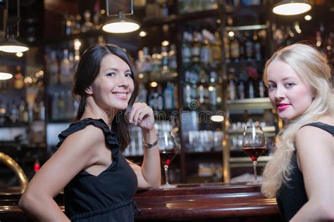 Two Women Drinking At An Upmarket Hotel Stock Photos
