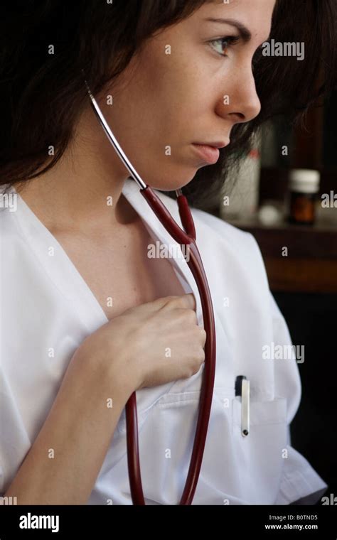 Young Woman Doctor Listening Its Own Heart With A Stethoscope Stock