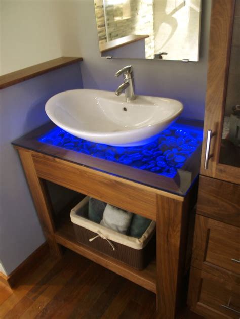 Here, a stone countertop draws the eye down the length of a floating vanity. Pin on DIY Inspired