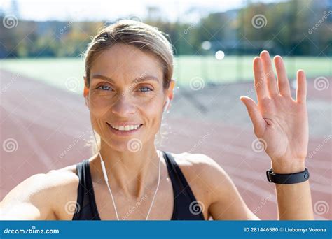 Female Athlete After Jogging In Stadium Talking With Friends And Recording Online Video Blog