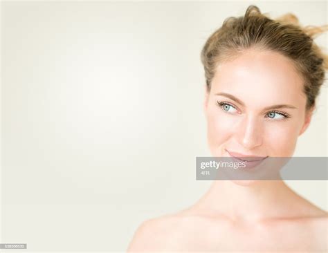 Cute Woman Looking Into Free Copy Space High-Res Stock Photo - Getty Images