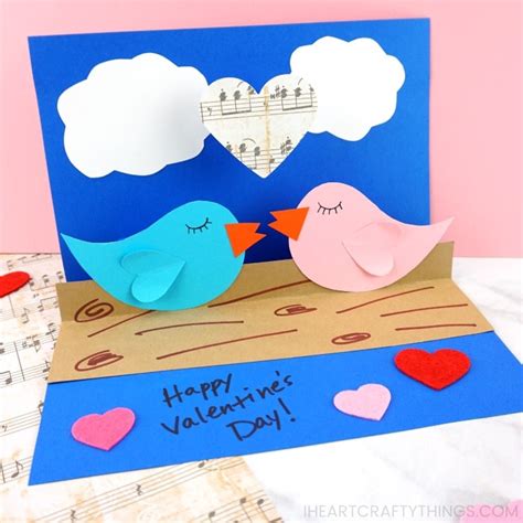 Cut slits on the folded part. How to Make a Pop-Up Love Birds Card in 2020 | Pop up card ...
