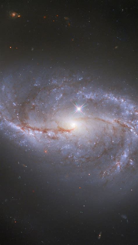 La imagen se creó a partir de imágenes tomadas. Barred spiral galaxy NGC 2608 in the constellation Cancer ...