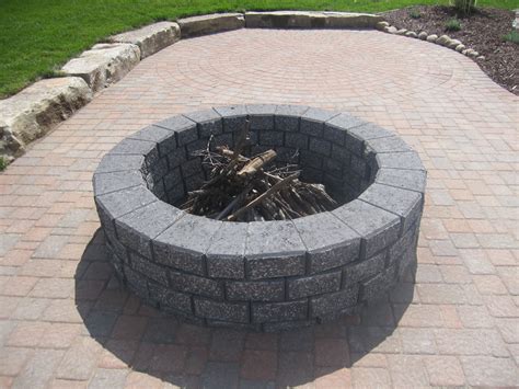 Assuming you don't have any fancy gas ignition systems on your offset smoker, the best way to light your coals is with a chimney starter.; Split-n-stack Charcoal color brick fire pit. | Brick fire ...