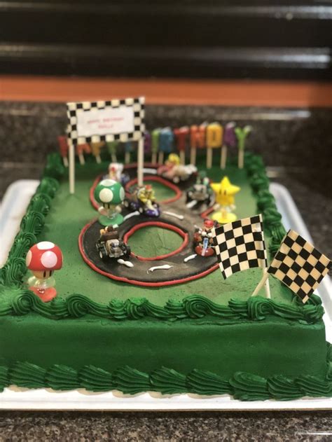 Super mario birthday cake | super mario party ideas. Mario Kart Cake | Mario kart cake, Table decorations, Cake