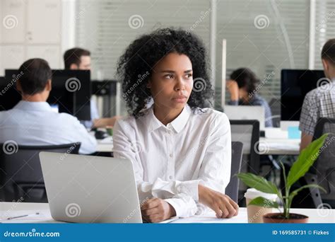 Upset And Distracted Young Woman Sit On Sofa In Room She Hold Red Laptop Young Woman Point On