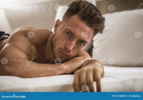 Shirtless Male Model Lying Alone On His Bed Stock Image Image Of Male Pillow 131106947