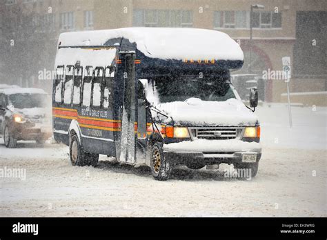 A Bus Covered In Snow Drives In Snowy Roads In Canada Stock Photo Alamy