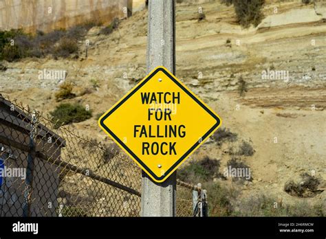 Watch For Falling Rock Caution Road Sign Stock Photo Alamy