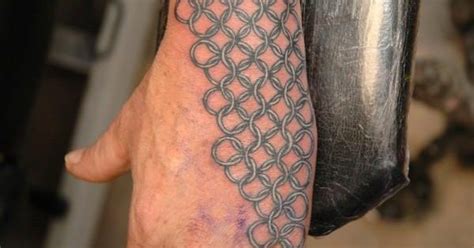 Cross tattoo represents different things to people. Chain mail in Tattoo Photos by Garreth Papworth | Chain ...