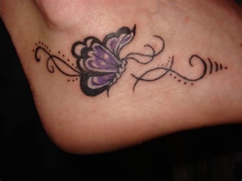 Purple small butterfly tattoo on foot - Tattooimages.biz
