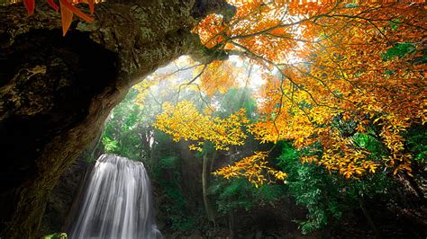 Landscape View Of Waterfalls From Rock Mountain Autumn Green Yellow