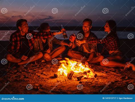 Young Friends Have Picnic With Bonfire On The Beach Stock Image Image