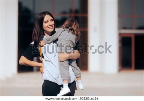 Cheerful Mom Holding Her Toddler Daughter Stock Photo 2053516196