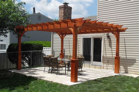 Dig a hole 6 inches deep and pour drainage rock into. Backyard patio with a stand-alone wood pergola. | Pergola ...
