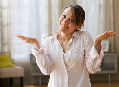 Woman Shrugging Shoulders Stock Photos Pictures And Royalty Free Images