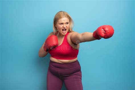 Fat Girl In Fitness Suite Does Boxing Cyan Background Stock Image Image Of Fight Calorie