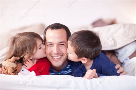 Son And Daughter Kissing Fathers Cheek Stock Image F0085944 Science Photo Library