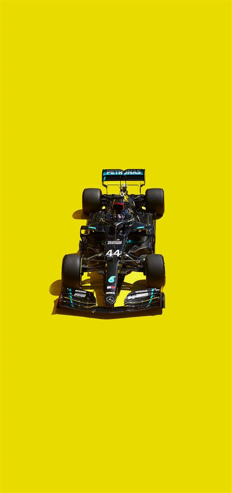 Download Lewis Hamilton Phone Yellow Background Wallpaper