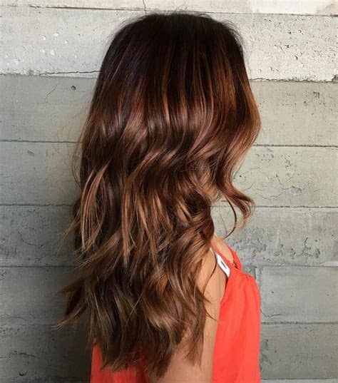 It features flattering blonde balayage highlights for dark chocolate hair. 60 Auburn Hair Colors to Emphasize Your Individuality