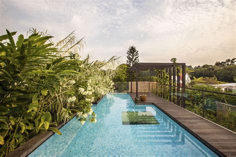 Lush Gardens And Peekaboo Roof Pool Define Contemporary Home