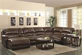 Rolled arm sofas face off over ornate carved wood ottoman coffee table with brown leather cushion surface, nail head trim, and carved arrow feet. Best Sectional Sofas with Recliners and Chaise - HomesFeed