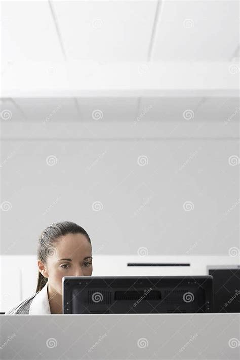 Businesswoman Using Computer In Cubicle Stock Image Image Of