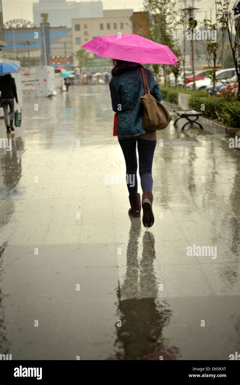Girl Walking Under The Rain With A Pink Umbrella Stock Photo 67737568