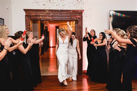 Same Sex Brides Enter Reception Under Shower Of Confetti