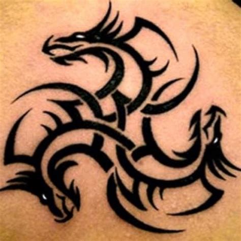 Awesome Tribal Dragon Tattoo On Leg