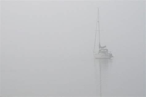 Sailboat In Fog Photograph By Tim Nyberg