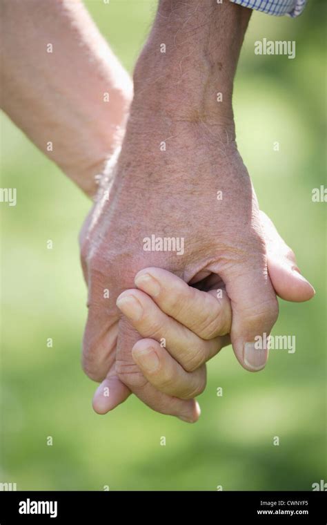 Germany Bavaria Senior Couple Holding Hands Close Up Stock Photo Alamy