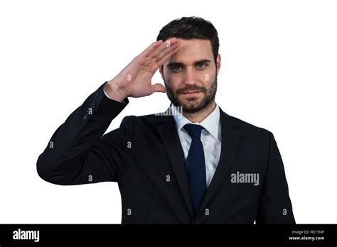 Businessman Saluting Against White Background Stock Photo Alamy