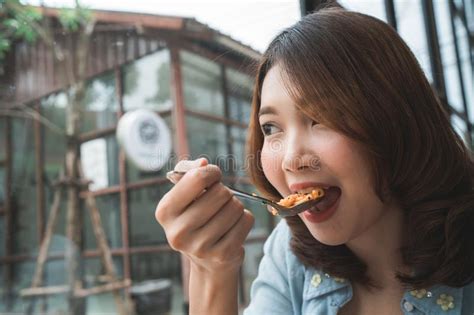Beautiful Happy Asian Woman Eating A Plate Of Italian Seafood Spaghetti