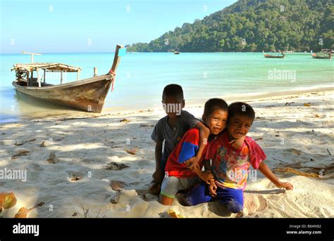 Moken Sea Gypsy Kids Enjoy Playing With Sand By The Beachkoh Surin