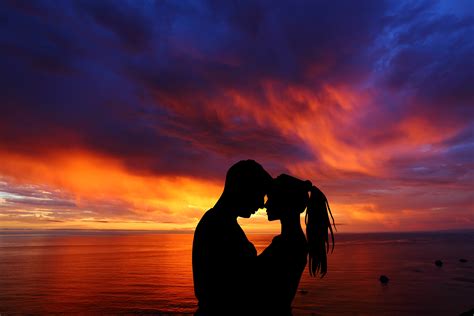 Love encompasses a range of strong and positive emotional and mental states, from the most sublime virtue or good habit, the deepest interpersonal affection, to the simplest pleasure. Couple 4K Wallpaper, Romantic, Silhouette, Sunset ...