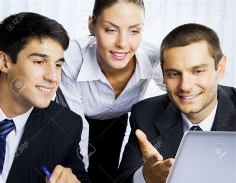 11080310 Three Happy Smiling Successful Business People Working With