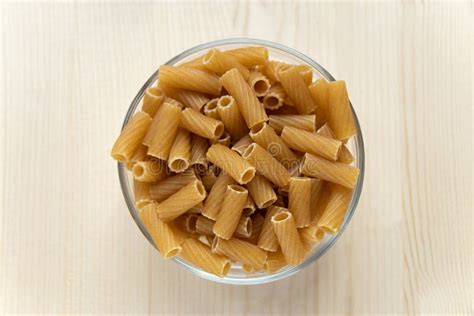 Raw Durum Wheat Pasta In Bowl On Wooden Background Uncooked Pasta
