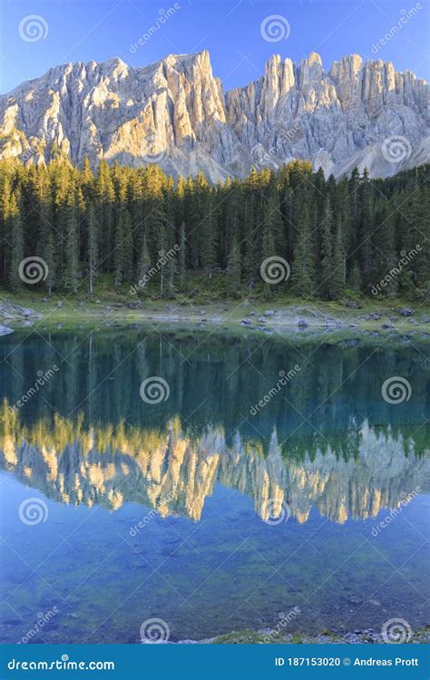 The Latemar Mountain Range Mirrored In Lake Carezza Karersee Lago