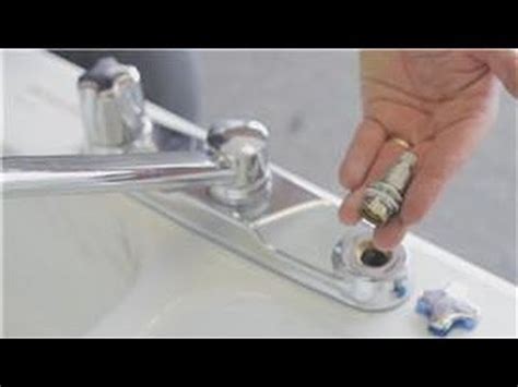 Most faucets begin leaking around the cartridge inside the valve body when the seals get worn or the cartridge its. Faucet Repair : How to Repair a Dripping Kitchen Two ...