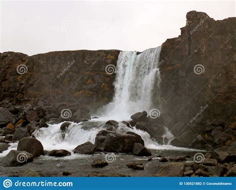 Oxararfoss Waterfall Under The Autumn Cloudy Sky Thingvellir National