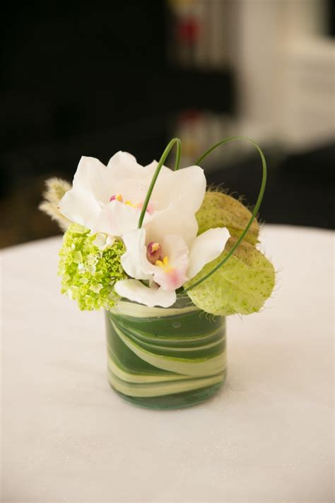 It is fairly low and so not suitable for sitting around and drinking coffee while sitting on chairs, although for those sitting on detail such as flowers, swirls, birds, and lines can often be seen carefully engraved into the table top. cocktail table arrangements - Loris Decoration