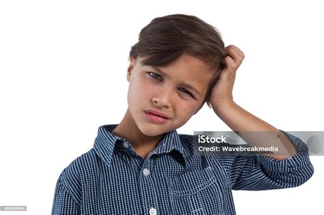 Depressed Boy Standing Against White Background Stock Photo Download