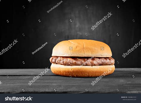 Plain Beef Burger On Wooden Table Stock Photo 1069861913 Shutterstock