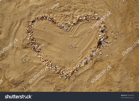 Love Heart Made Of Shells On Beach Background Concept