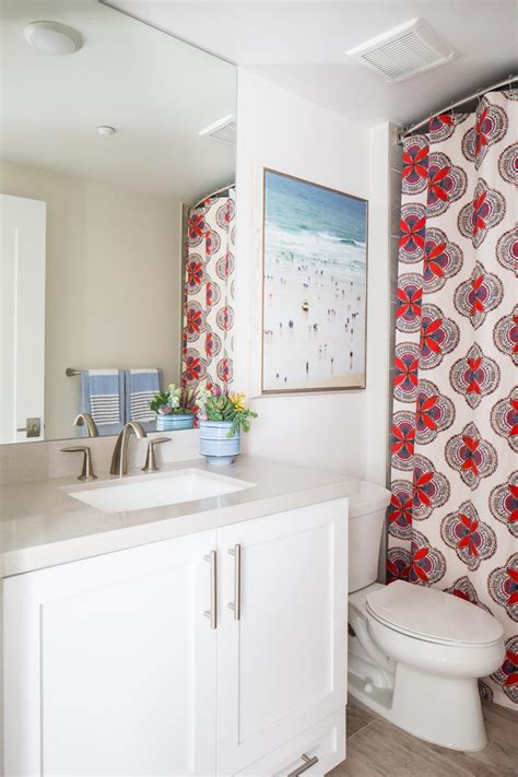 Contemporary White Bathroom With Red And Blue Shower