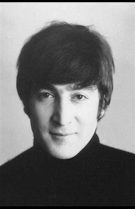 An Old Black And White Photo Of A Man In A Turtle Neck Sweater Looking At The Camera