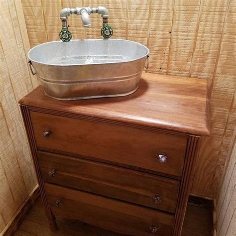Because they get heavy everyday use, bathroom sinks can easily become chipped, stained, or scratched over time. Sink in our cabin bathroom. Refinished dresser. Top drawer ...